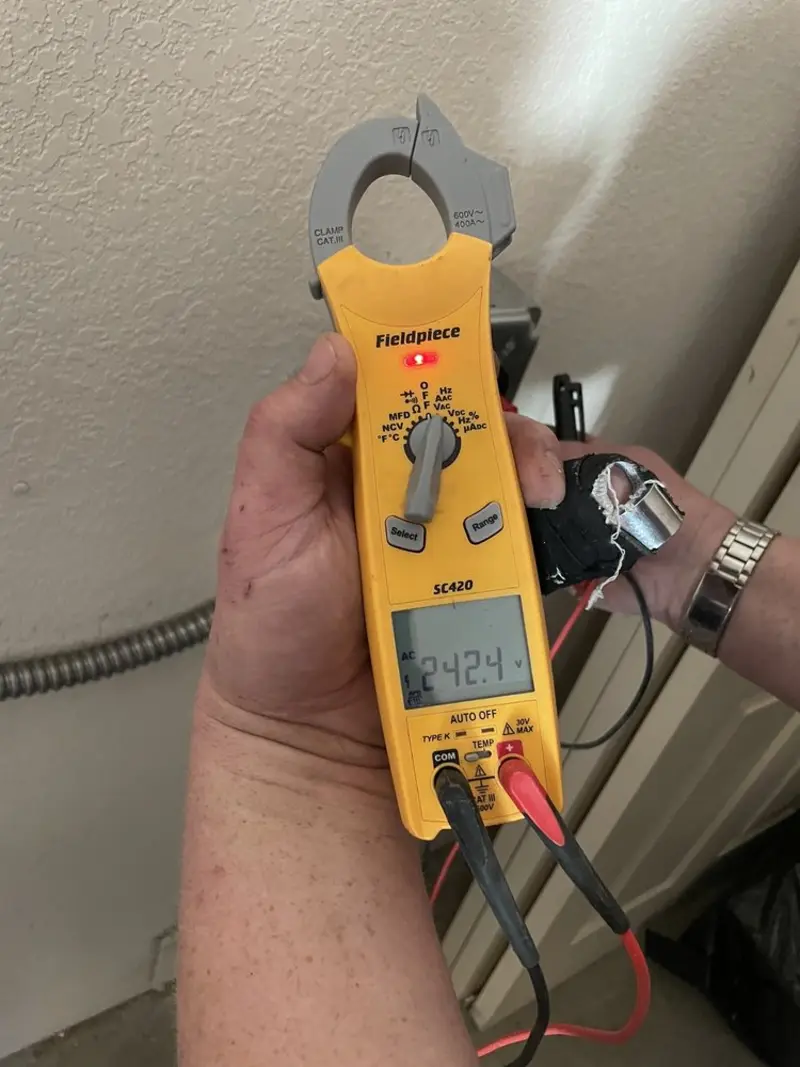 Voltage testing with clamp meter during Electrical Installation Services in Penn Yan